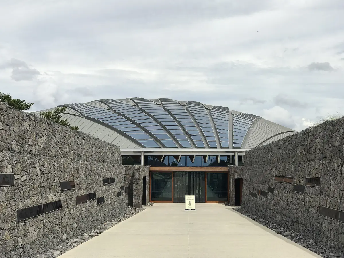 Entrance walk between tall gabion walls at the National Arboretum Canberra